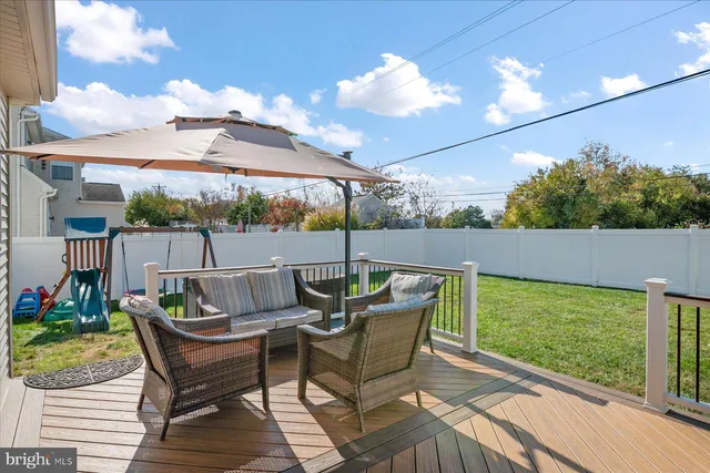 a patio with table and chairs