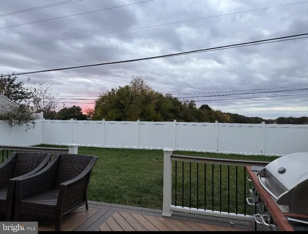 a terrace of a house with outdoor seating