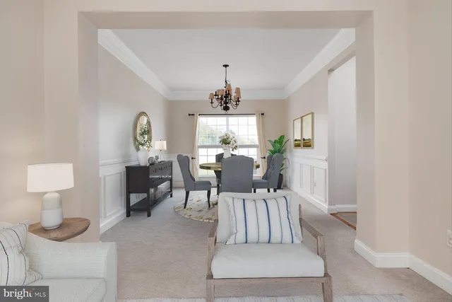 a view of a livingroom with furniture window and wooden floor