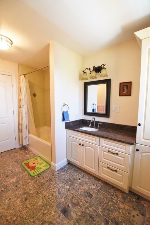 15 Augustus Road Lexington, MA 02421 - Photo 17 of 28 a spacious bathroom with a sink a mirror and a bathtub
