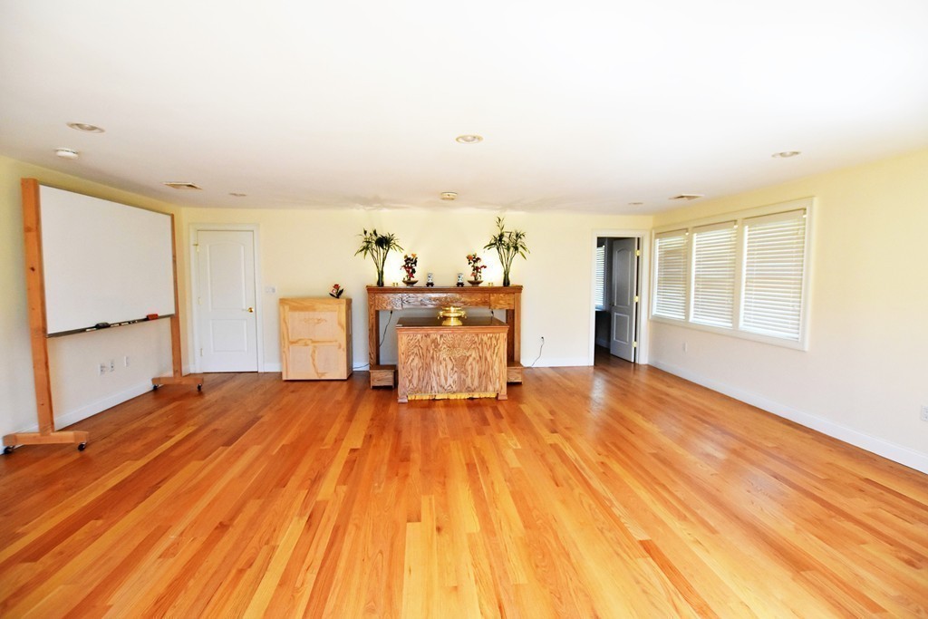 15 Augustus Road Lexington, MA 02421 - Photo 20 of 28 a view of a living room with a flat screen tv