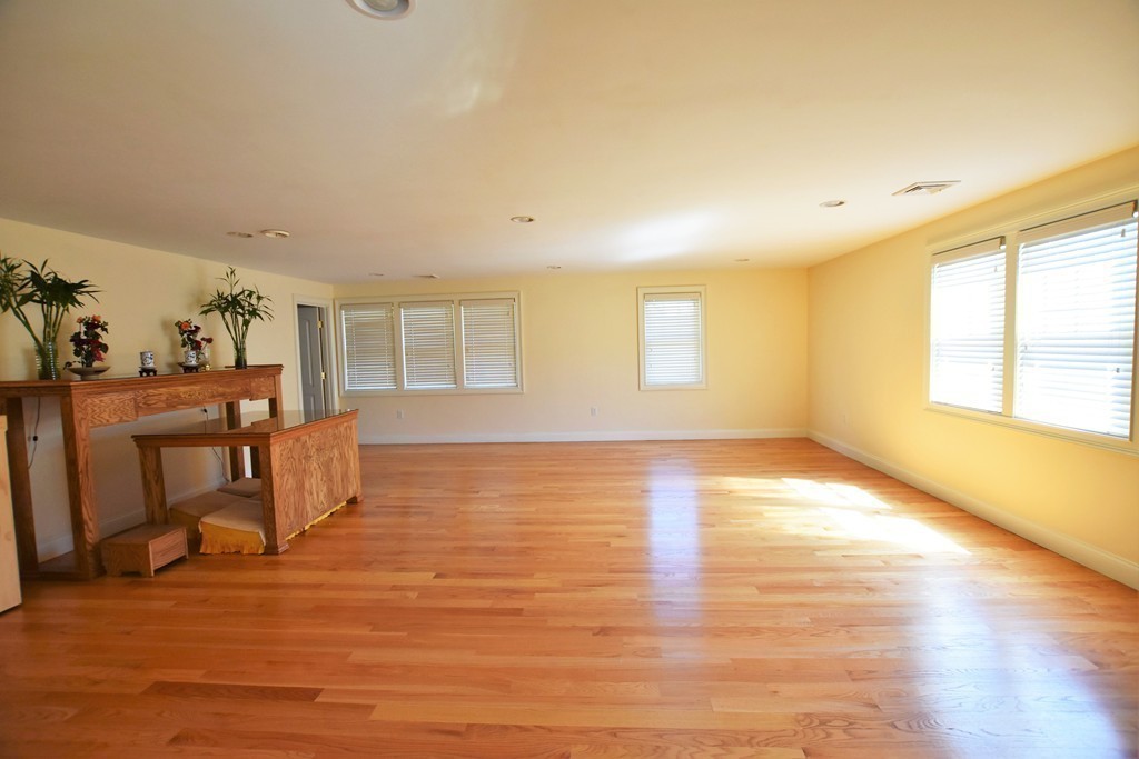 15 Augustus Road Lexington, MA 02421 - Photo 21 of 28 a view of an empty room with window and wooden floor