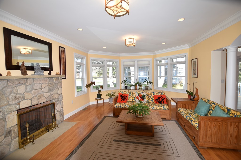 15 Augustus Road Lexington, MA 02421 - Photo 6 of 28 a living room with furniture and a fireplace