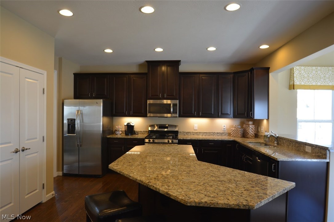 32304 Pepper Ridge Run North Ridgeville, OH 44039 - Photo 10 of 30 Kitchen with granite countertops and upgraded stainless steel appliances