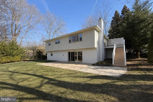a view of a street with a houses on both side of the road