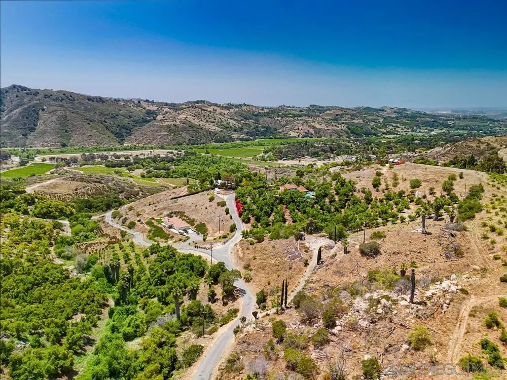 31675 Rancho Amigos Road, Unit 1 Bonsall, CA 92003 - Photo 17 of 19 a view of a city with mountains in the background