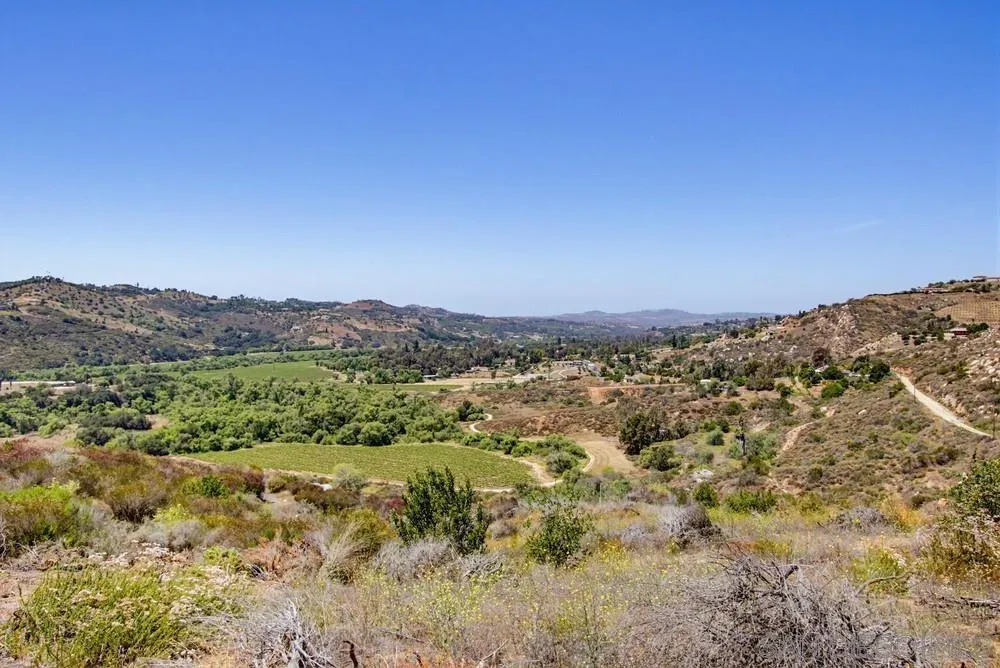31675 Rancho Amigos Road, Unit 1 Bonsall, CA 92003 - Photo 10 of 19 a view of a large mountain with mountains in the background
