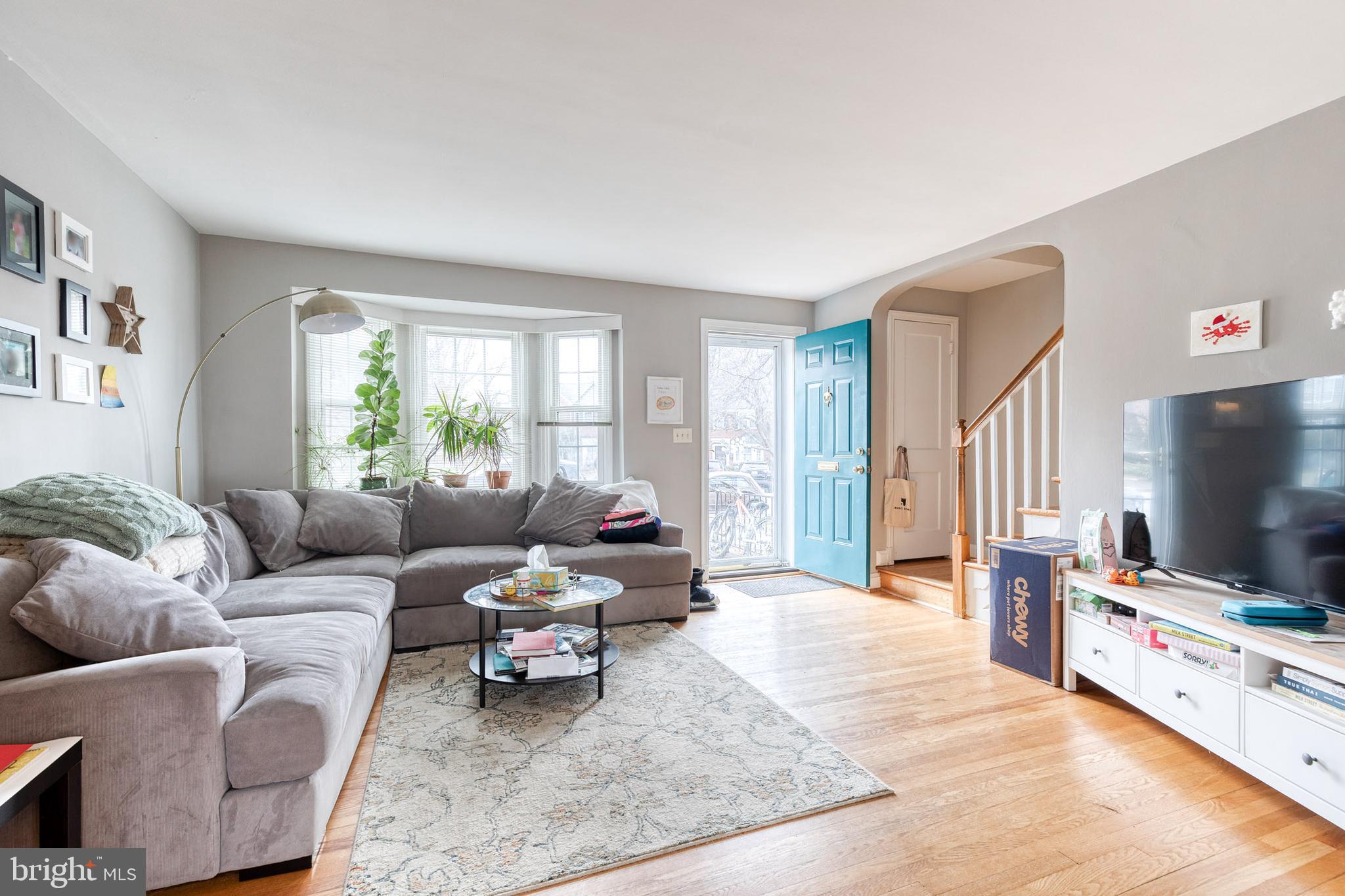 a living room with furniture and a flat screen tv