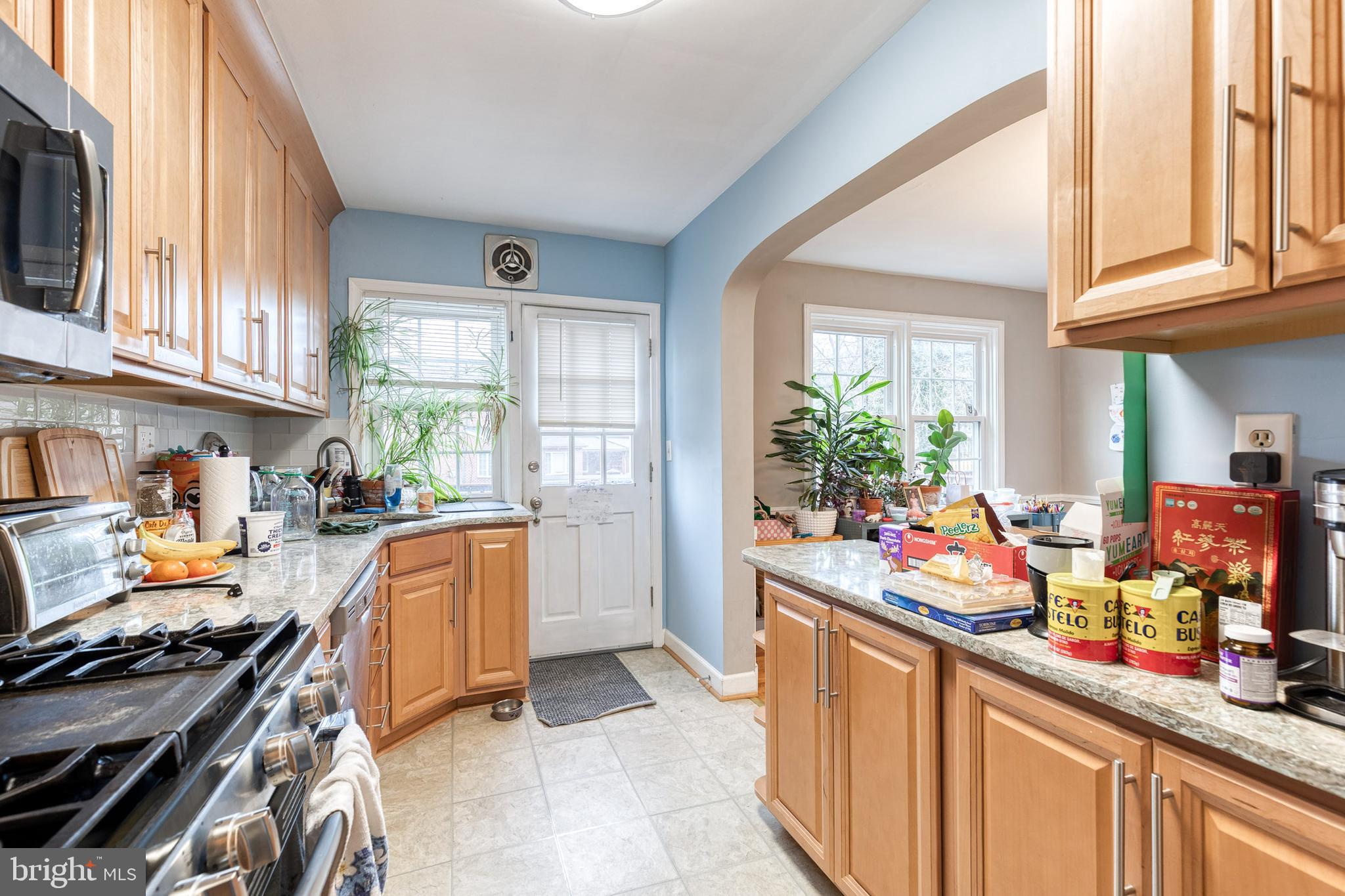 110 Regester Avenue Baltimore, MD 21212 - Photo 12 of 15 a kitchen filled with a white stove top oven sink and cabinets