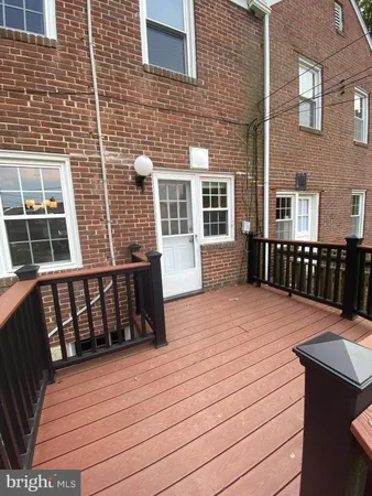 a balcony view with a wooden floor