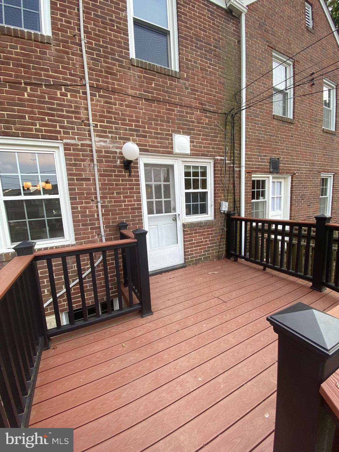 110 Regester Avenue Baltimore, MD 21212 - Photo 13 of 15 a balcony view with a wooden floor