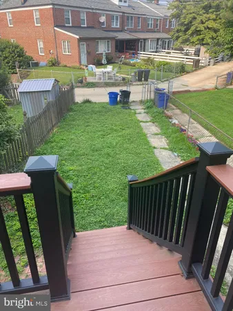 a view of a patio with a table and chairs