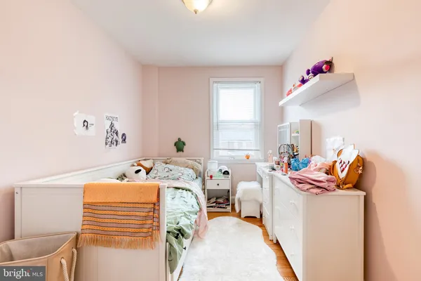 a bedroom with furniture and a window
