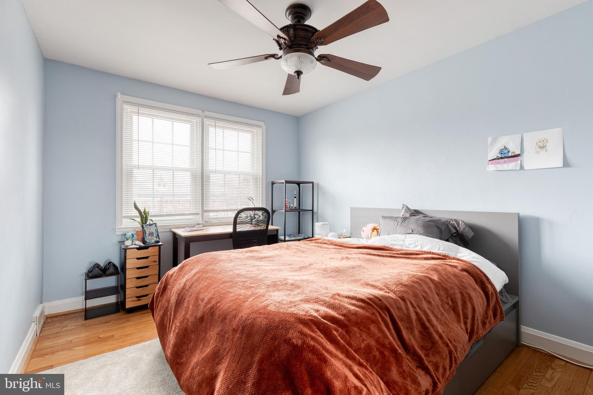 110 Regester Avenue Baltimore, MD 21212 - Photo 6 of 15 a bed sitting in a bedroom next to a window
