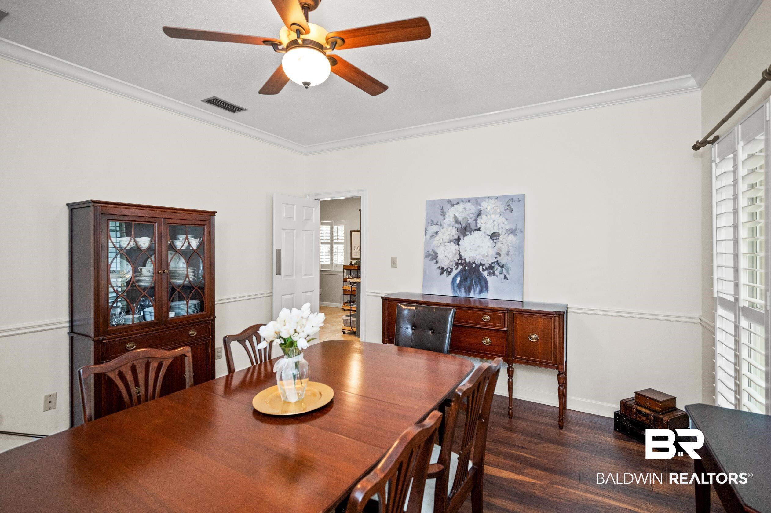 6638 Jackson Square Daphne, AL 36526 - Photo 20 of 62 Dining area with dark hardwood / wood-style floors, ceiling fan, and ornamental molding