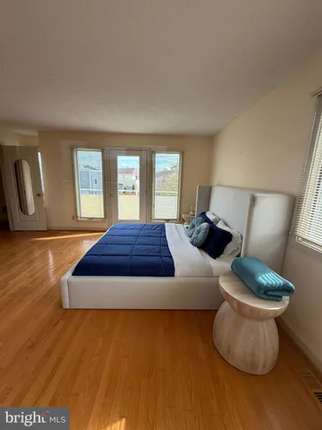 a spacious bedroom with a bed and window