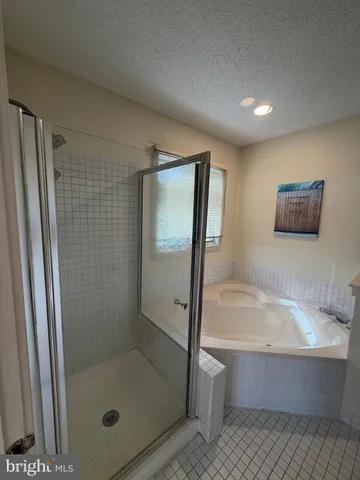 a bathroom with a shower and a sink