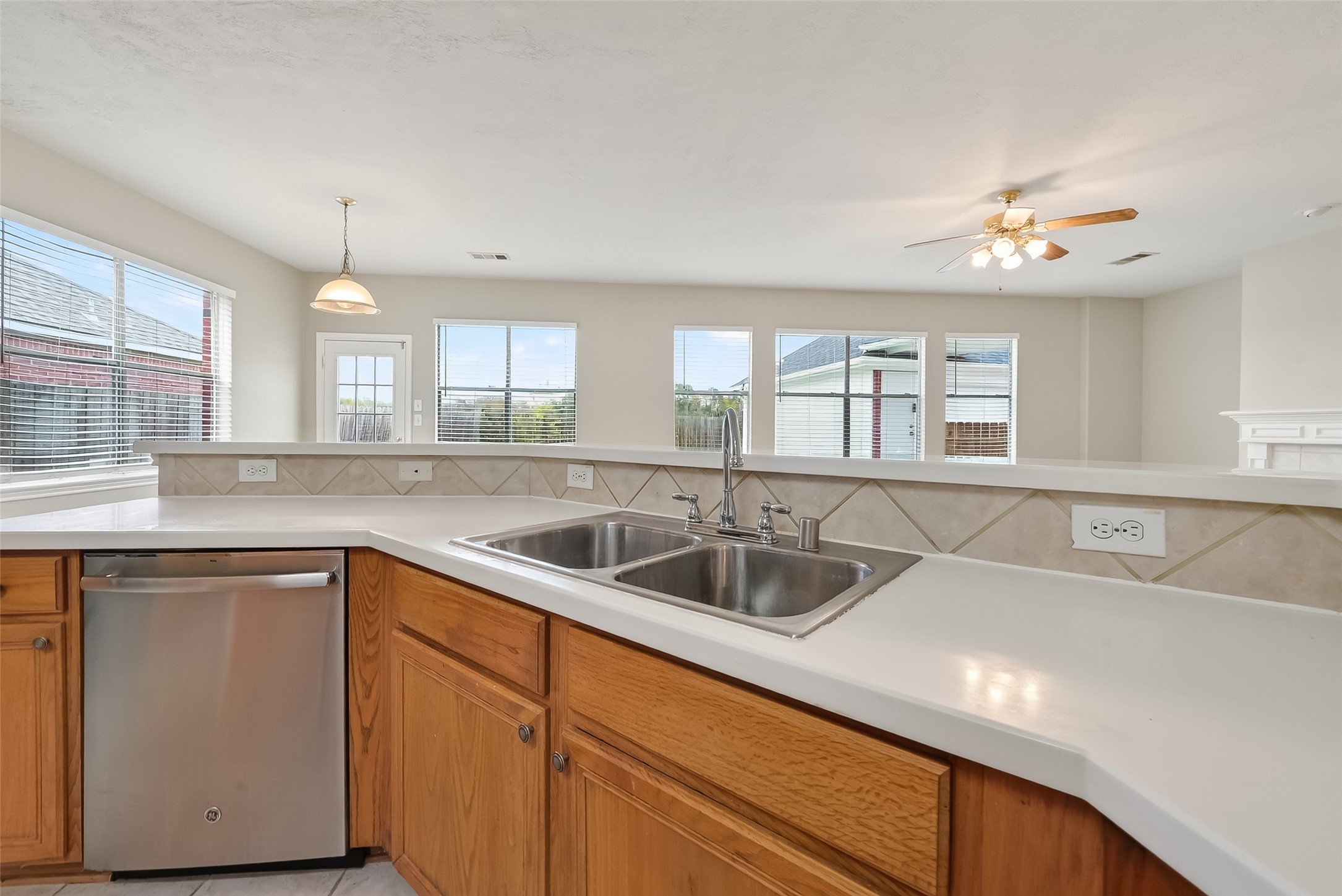 16639 Village View Trail Sugar Land, TX 77498 - Photo 15 of 50 a kitchen with a sink and chandelier