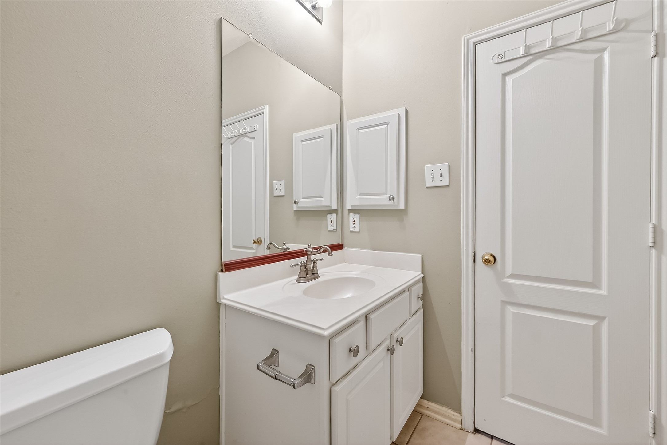 16639 Village View Trail Sugar Land, TX 77498 - Photo 26 of 50 a bathroom with a sink toilet vanity and a mirror
