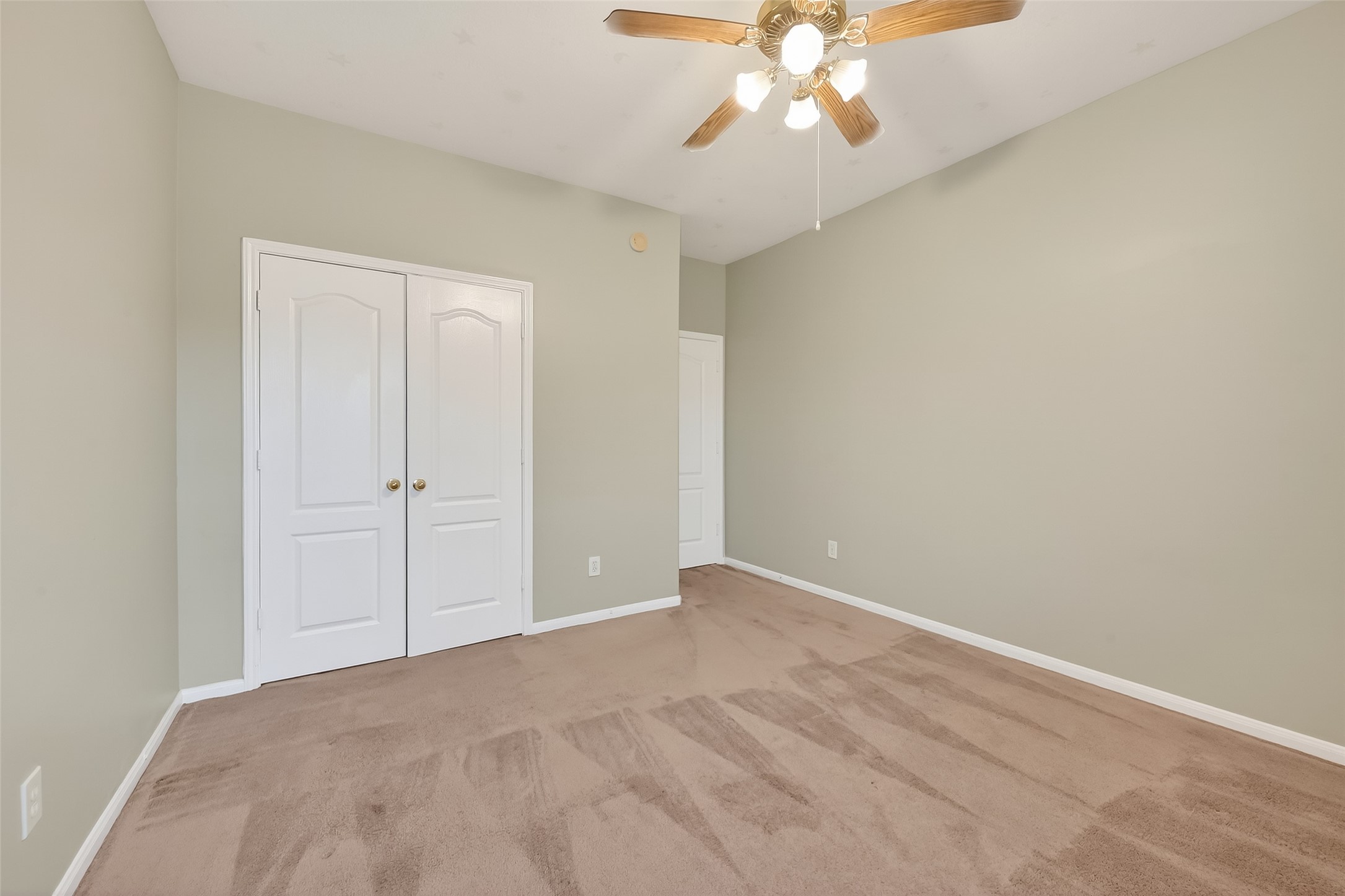 16639 Village View Trail Sugar Land, TX 77498 - Photo 35 of 50 a view of an empty room with a chandelier fan