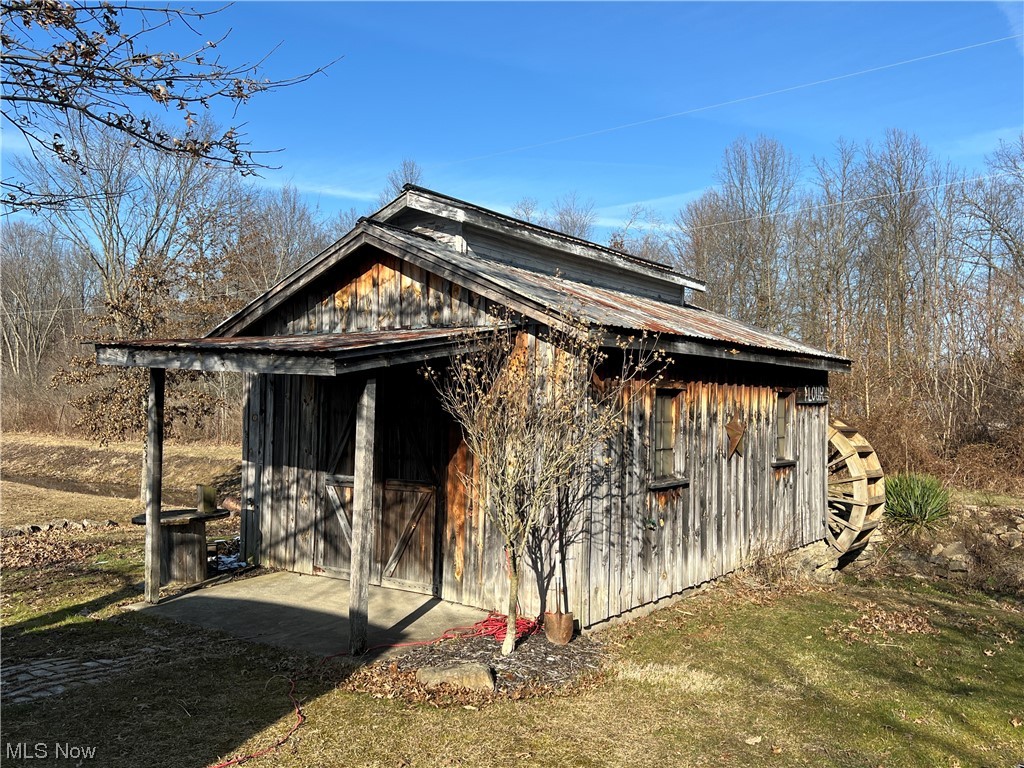 4512 Tabor Ridge Road Northeast Mineral City, OH 44656 - Photo 34 of 44 View of property exterior featuring an outdoor structure