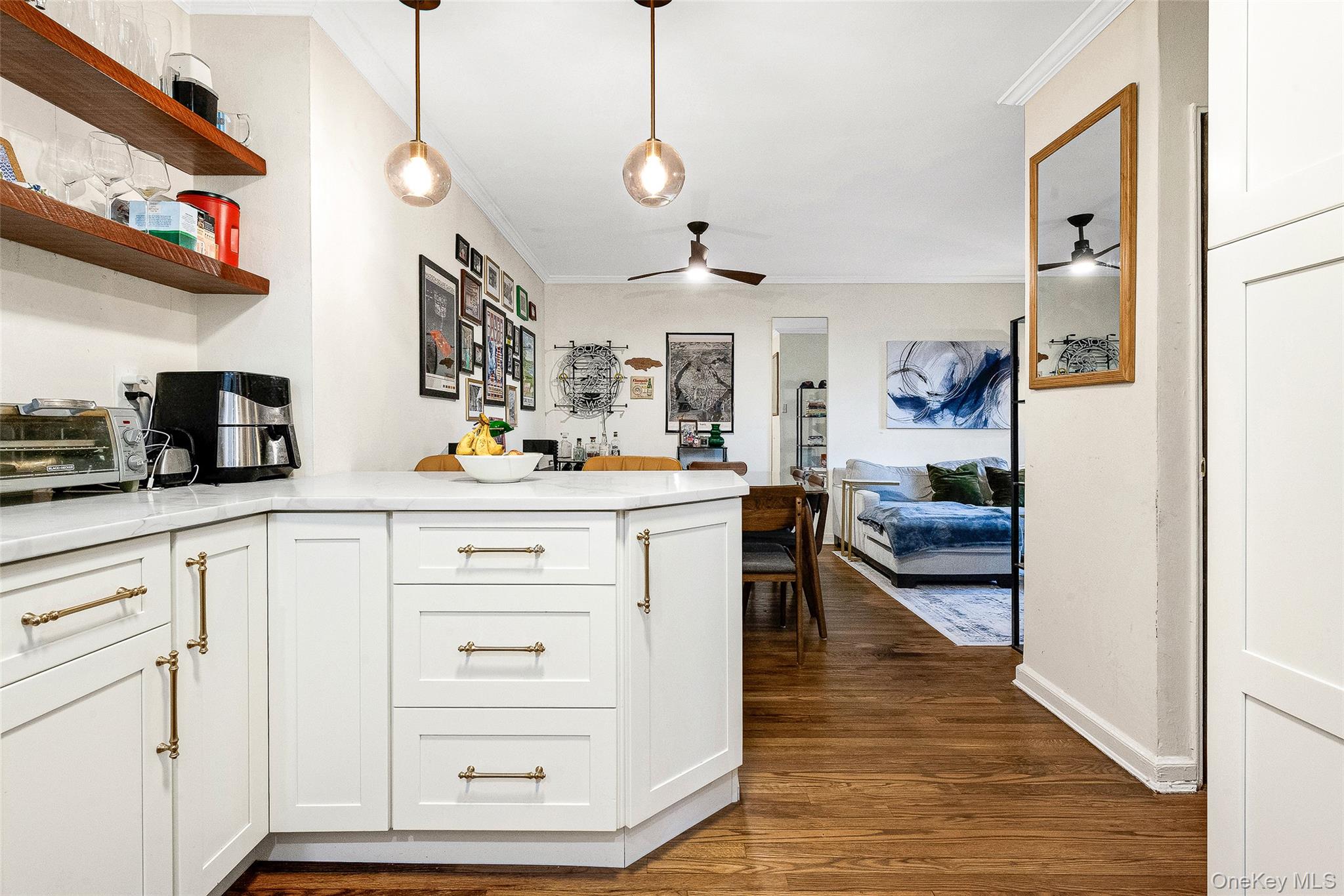 100-11 67th Road, Unit 508 Queens, NY 11375 - Photo 9 of 24 a kitchen with a refrigerator and white cabinets