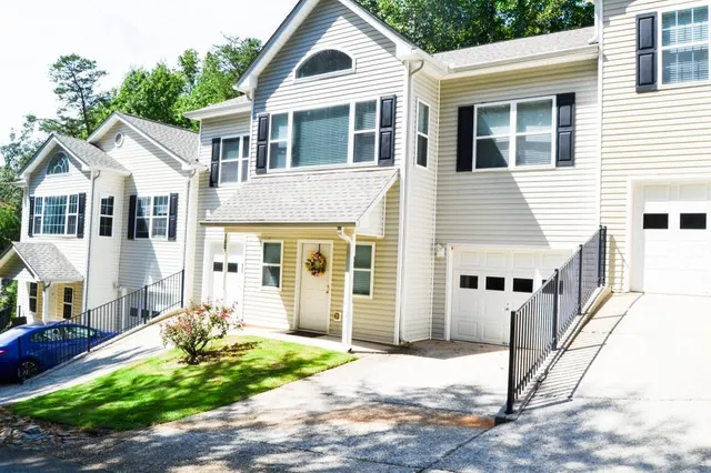 a front view of a house with garden