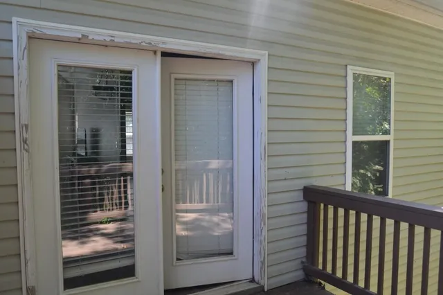 a view of a porch of a house with wooden floor