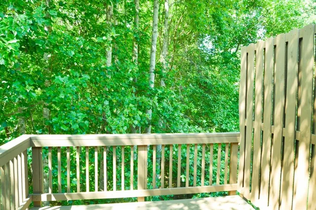 a balcony with wooden fence