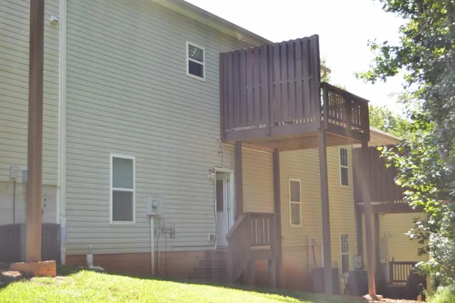 a view of a wooden door of the house