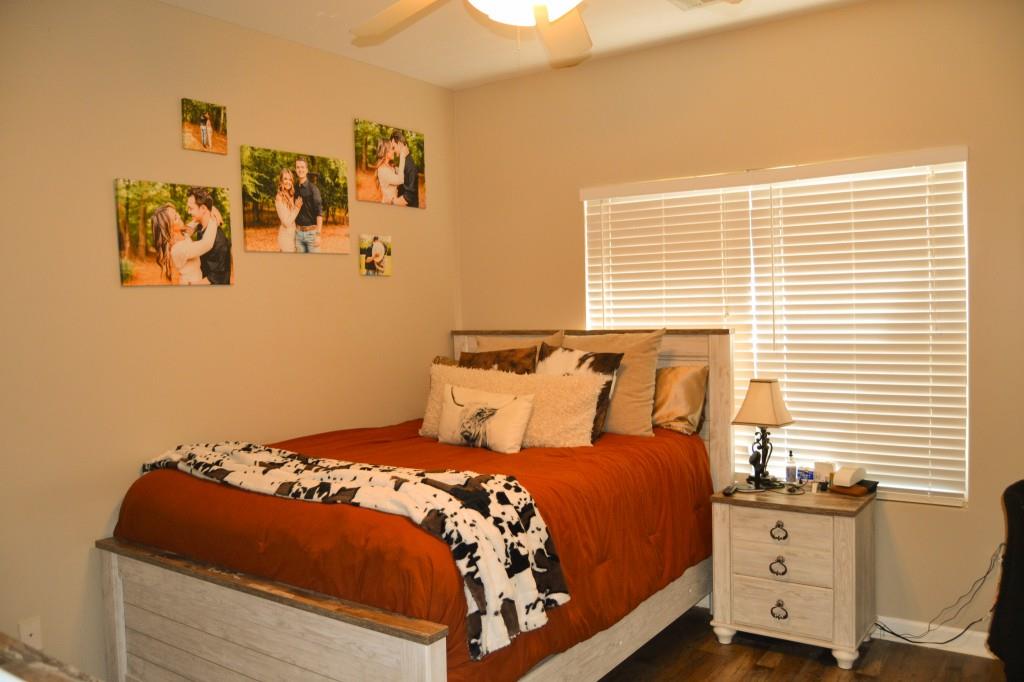 302 Pointe Circle Dahlonega, GA 30533 - Photo 8 of 19 a bedroom with a bed and painting on the wall