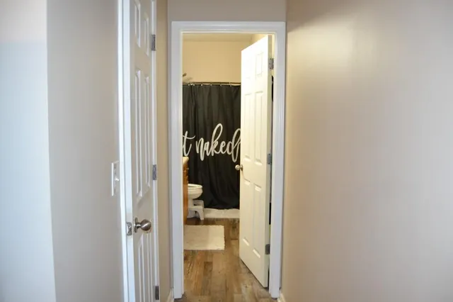 a view of a bathroom from a hallway