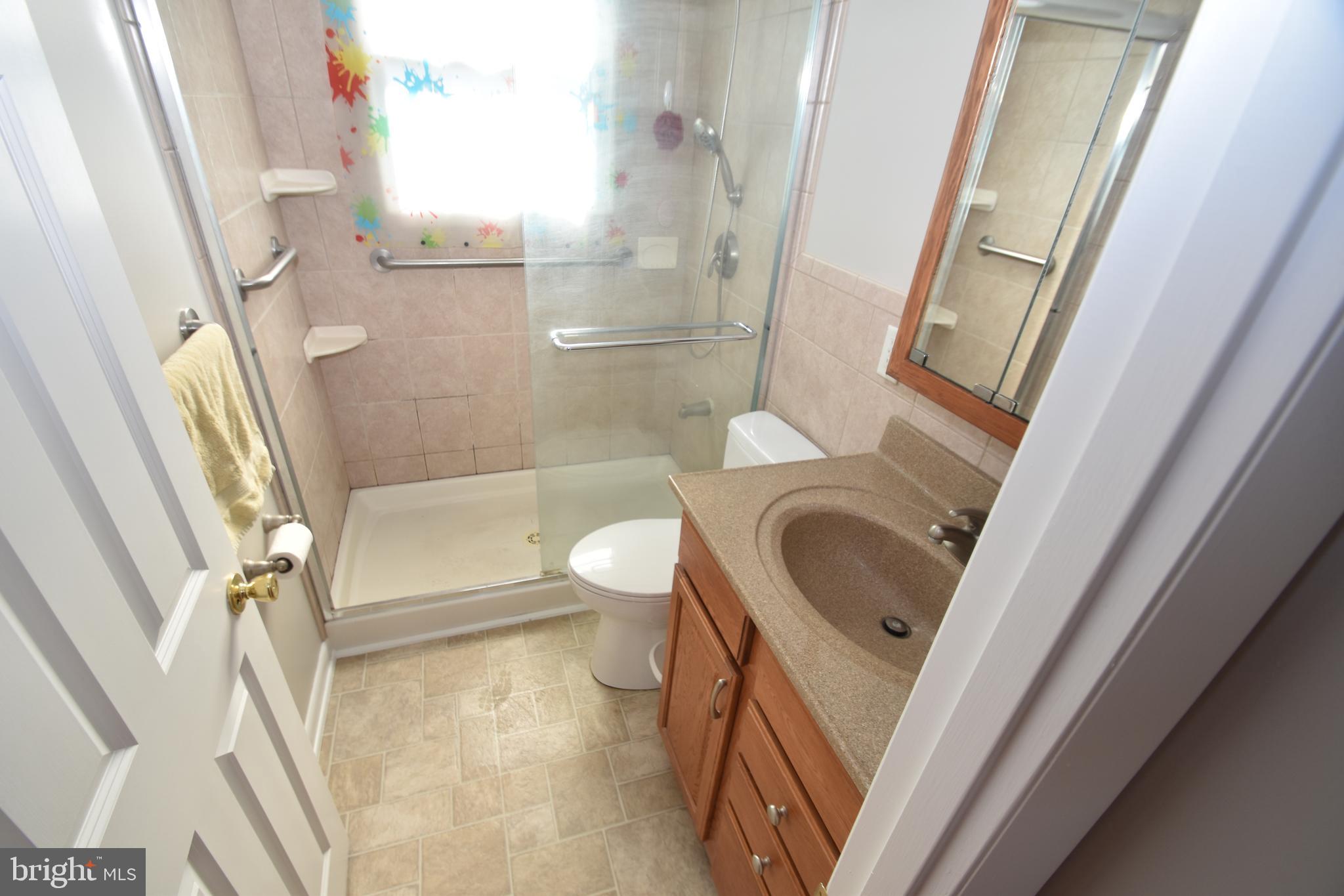1105 Ralph Road Newark, DE 19713 - Photo 19 of 41 a bathroom with a sink a toilet and a shower