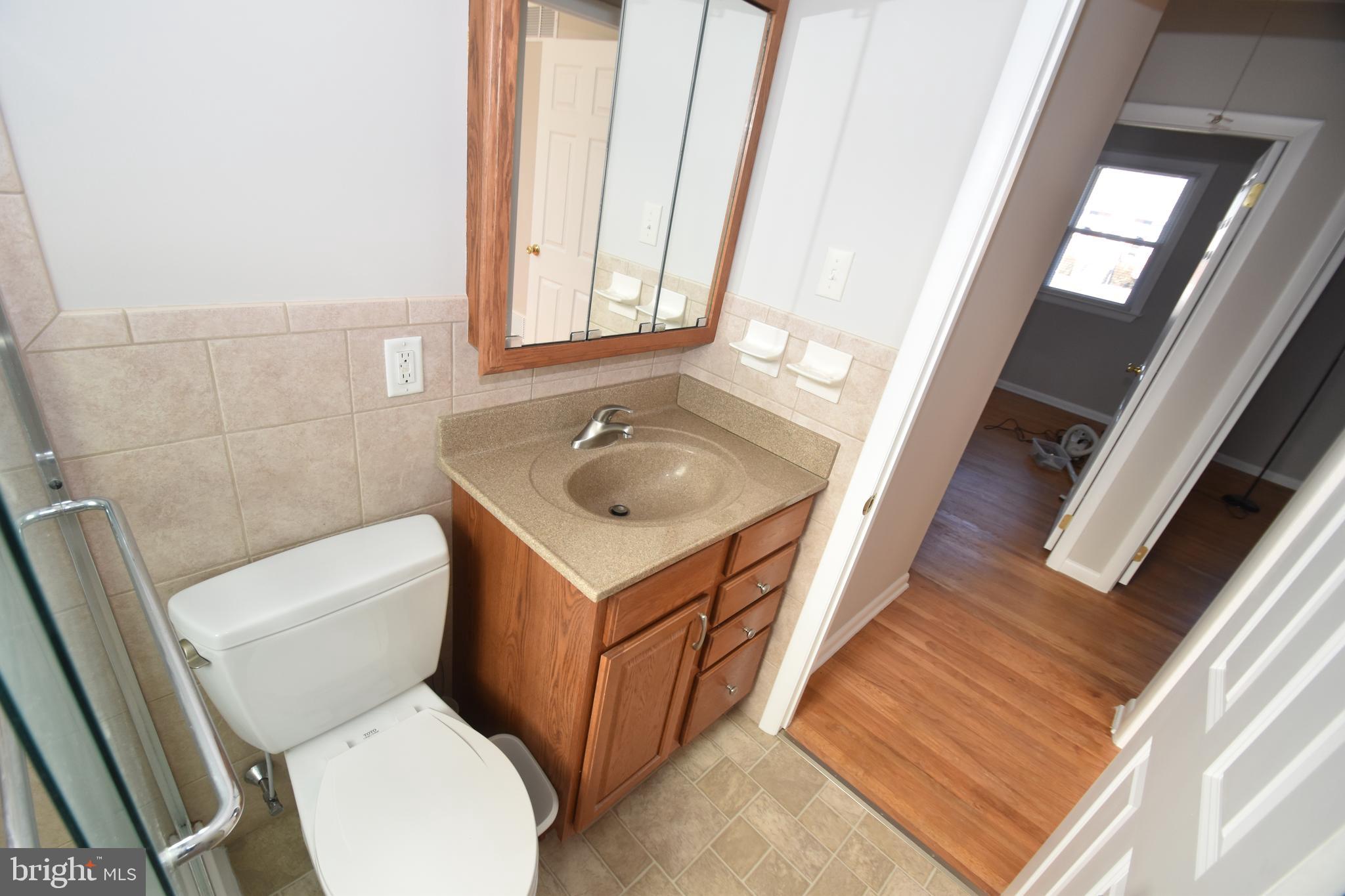1105 Ralph Road Newark, DE 19713 - Photo 20 of 41 a bathroom with a toilet sink and mirror