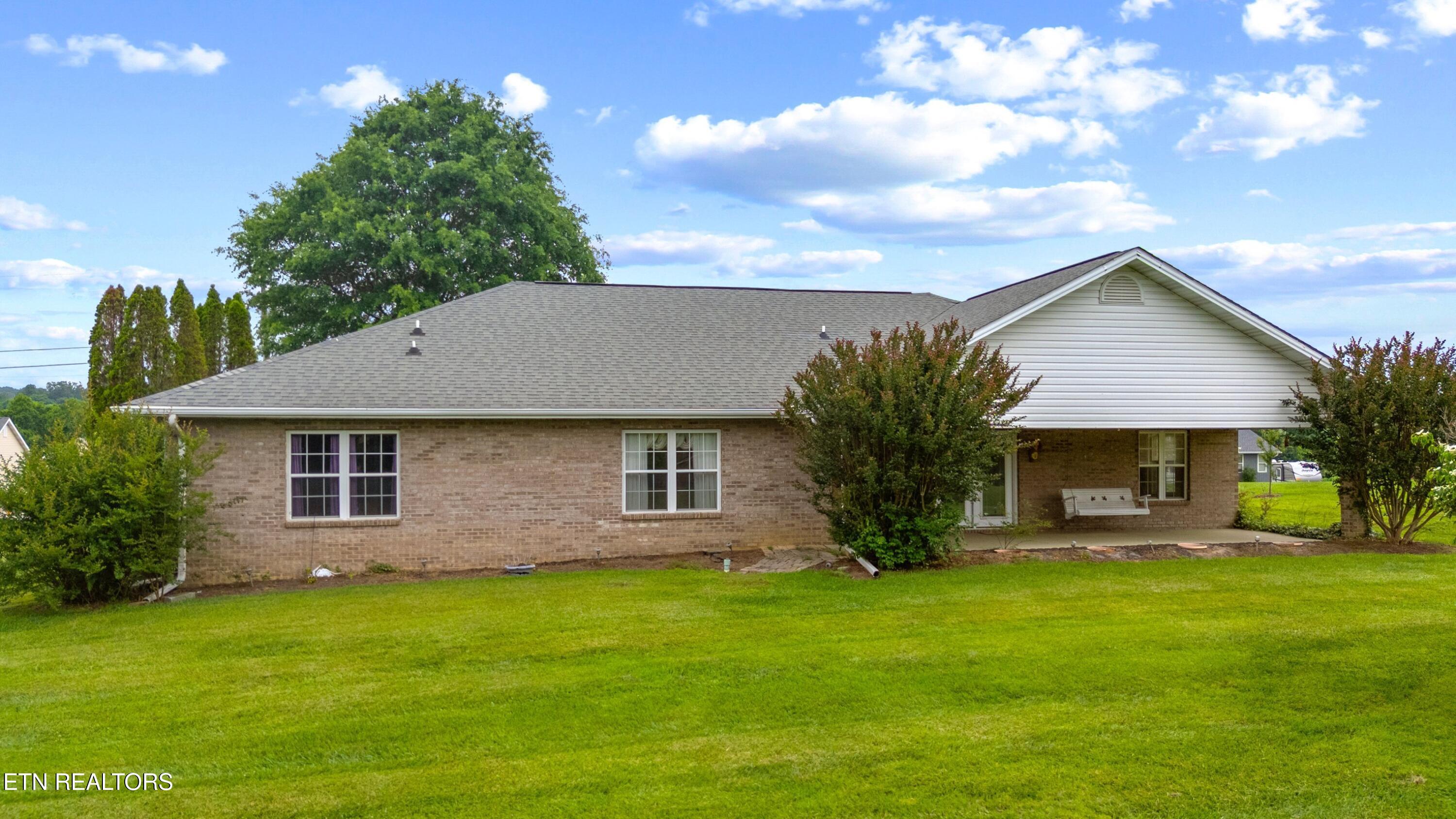 397 Terry Point Road Dandridge, TN 37725 - Photo 3 of 34 COVERED BACK PATIO