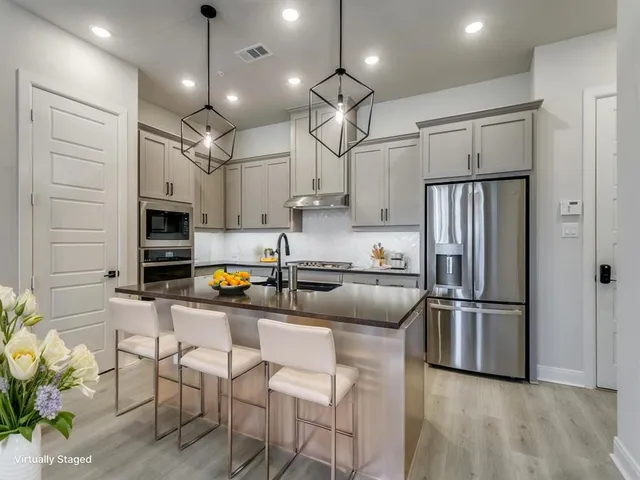 a kitchen with a table and chairs in it