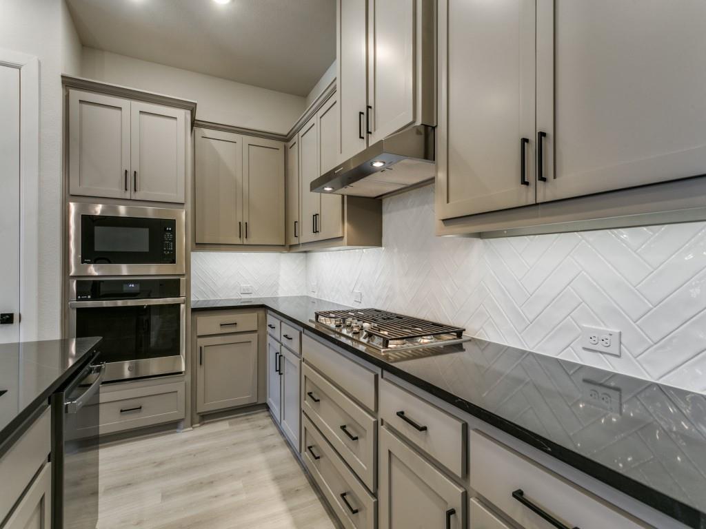 4823 Fuller Court, Unit 1003 Irving, TX 75038 - Photo 18 of 40 a kitchen with stainless steel appliances granite countertop a sink stove and cabinets