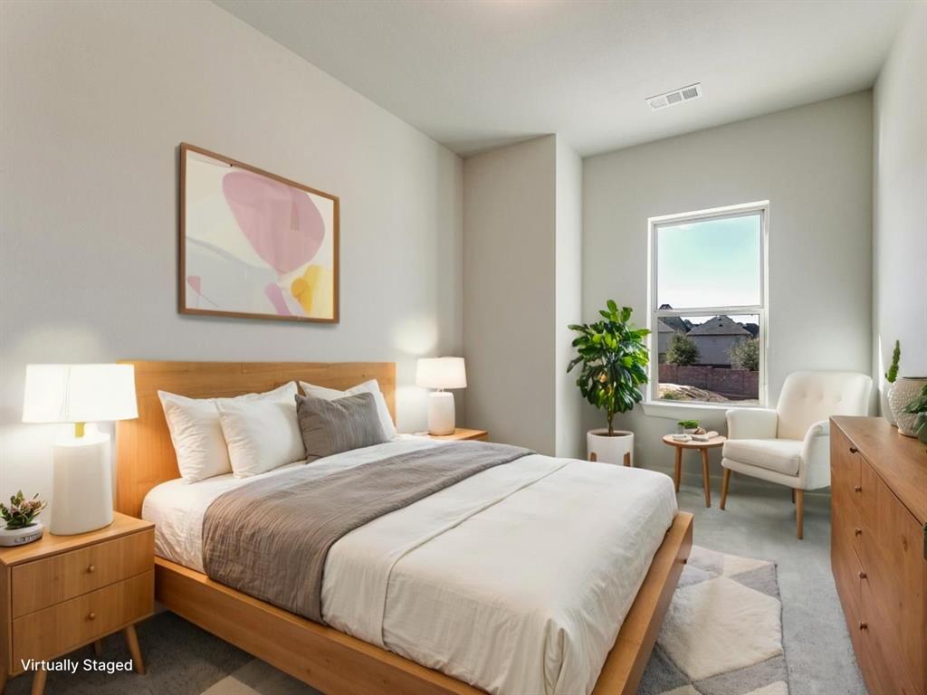 4823 Fuller Court, Unit 1003 Irving, TX 75038 - Photo 19 of 40 a bedroom with furniture and a potted plant