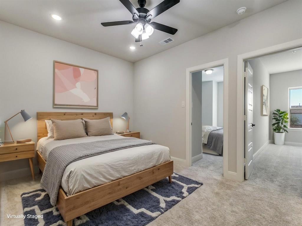 4823 Fuller Court, Unit 1003 Irving, TX 75038 - Photo 20 of 40 a bedroom with bed and a chandelier