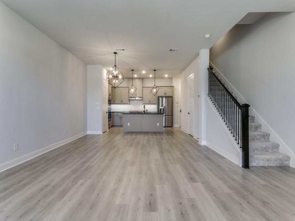 4823 Fuller Court, Unit 1003 Irving, TX 75038 - Photo 8 of 40 a view of a living room hardwood floor and a kitchen