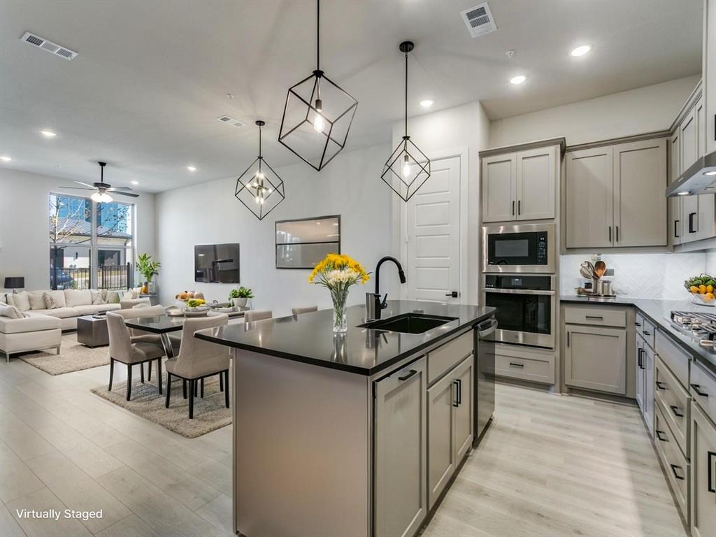4823 Fuller Court, Unit 1003 Irving, TX 75038 - Photo 40 of 40 a kitchen with stainless steel appliances granite countertop a sink and stove top oven