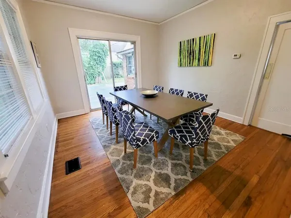 a bed with chair and a window