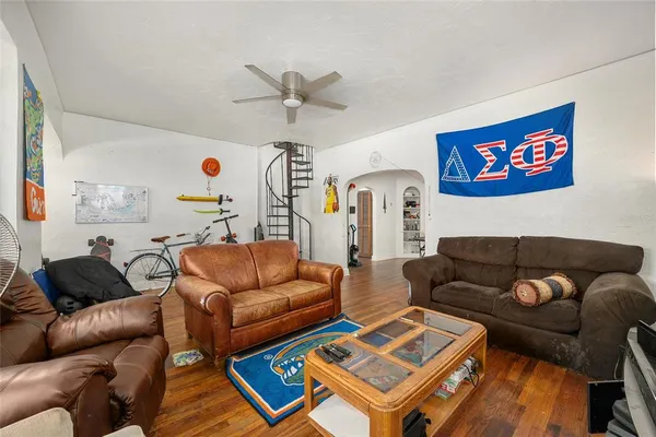 a view of a dining room with furniture and wooden floor