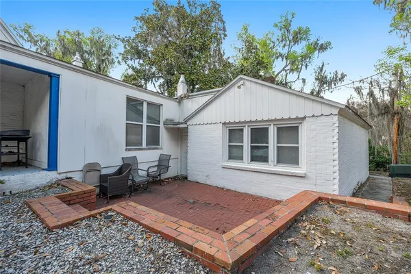 a view of a patio with wooden floor