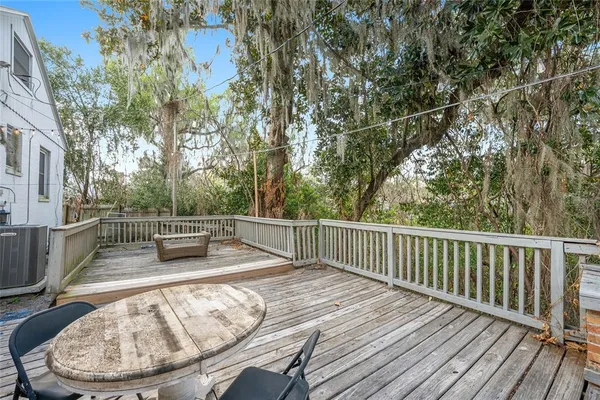 a backyard of a house with outdoor seating