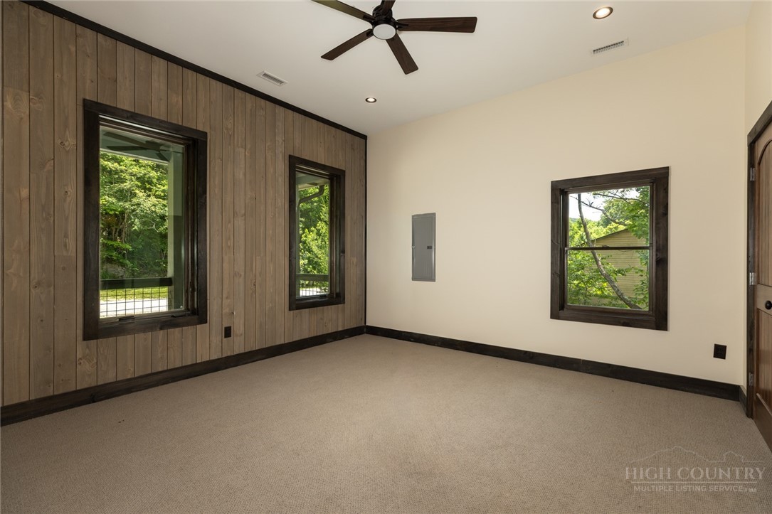 790 Howard Edmisten Road Sugar Grove, NC 28679 - Photo 18 of 45 an empty room with windows and closet