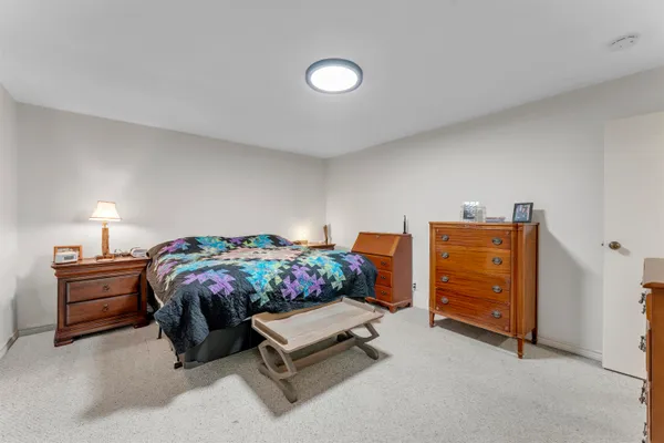 a bedroom with furniture and a bed