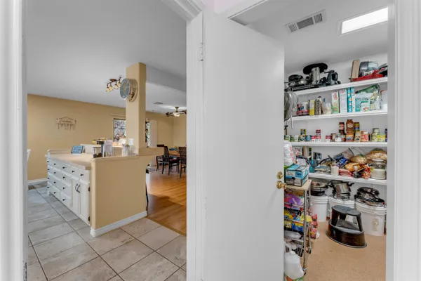 a kitchen with a refrigerator a stove and a sink