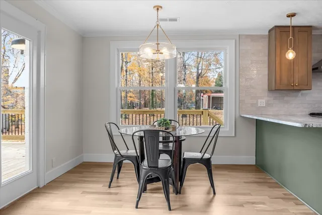 a dining room with furniture window wooden floor