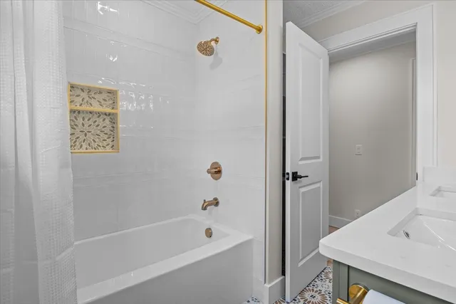 a bathroom with a tub and a sink